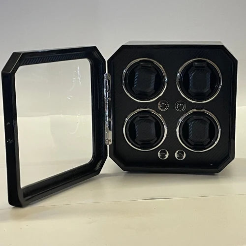 Remontoir montre Gioco Carbone noir pour 4 montres avec finition fibre de carbone, porte vitrée et éclairage LED intégré.