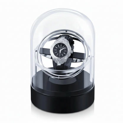 Remontoir de montre Astronome argenté en acier et verre avec base noire, design sphérique moderne pour une montre automatique.