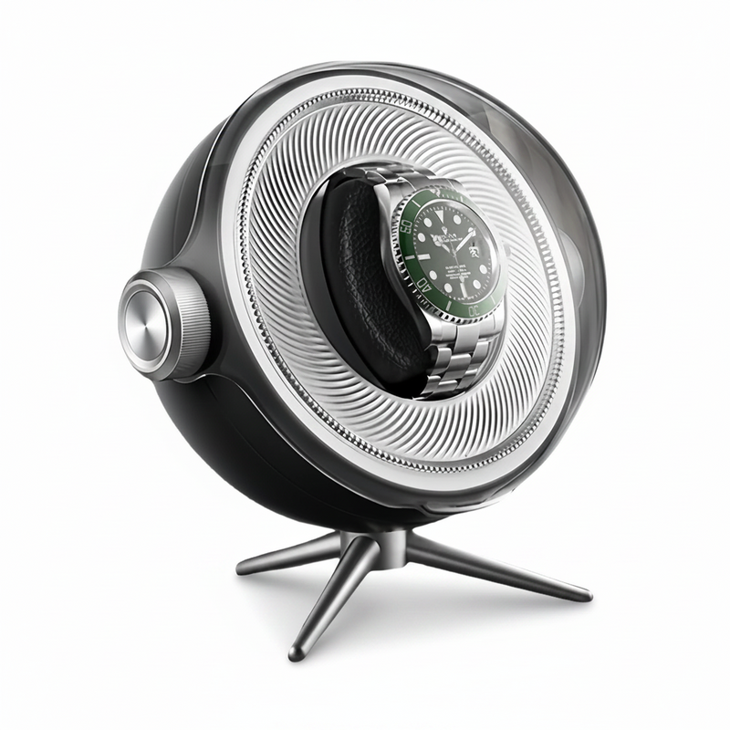 Remontoir de montre Tripode Solo noir au design sphérique moderne avec support trépied et montre automatique à cadran vert.